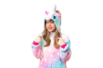 Young girl with unicorn pajamas over isolated chroma key background with surprise facial expression