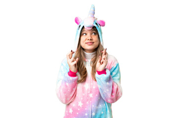 Young girl with unicorn pajamas over isolated chroma key background with fingers crossing