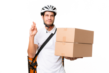 Delivery man wearing a helmet bike over isolated background with fingers crossing and wishing the best