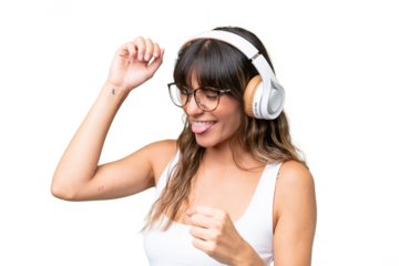 Young caucasian woman over isolated background listening music and dancing