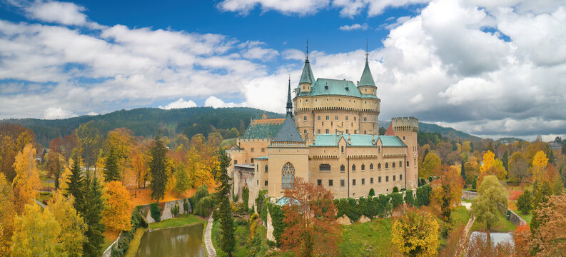 Aerial View of Bojnice Castle in a Neo-Gothic Romantic style against blue sky with clouds. UNESCO Heritage, Slovakia. 