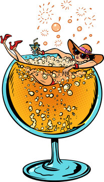 A girl floats in a glass of alcohol. Summer offers for tourists at the resort. Seasonal menu for bars, restaurants and pubs.