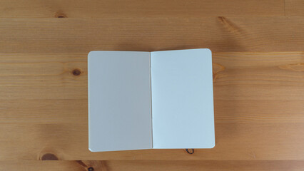 Minimalist Open Notebook on Wood