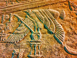 Stylized bas relief of vulture goddess Nekhbet on the walls in the Temple of Hathor at Dendera...