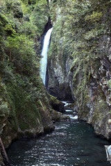 A waterfall among the rocks (Nesso Ravine)