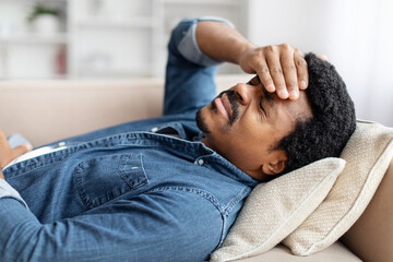 Unhealthy African American Man Lying On Couch