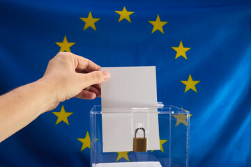 European Election Vote Concept. Hand placing a voting ballot into a clear box
