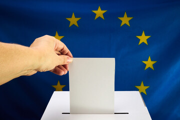 European Election Vote Concept. Hand placing a voting ballot into a clear box