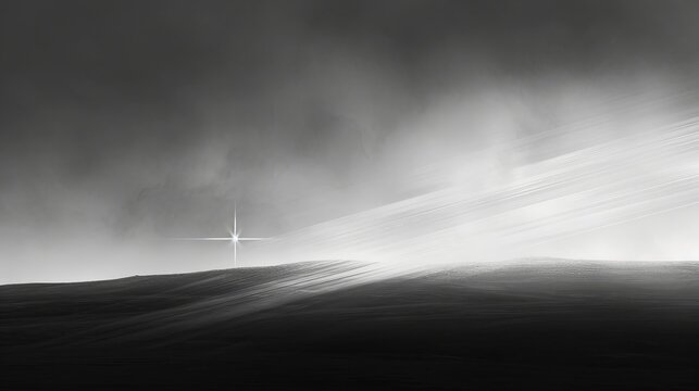   A monochrome image of a cross atop a hill against a backdrop of cloud-filled sky