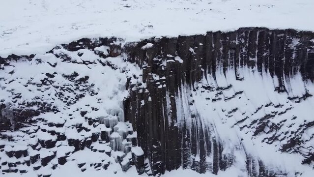 Plane close to the basaltic formations of the Studlagil canyon
