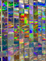 Close-up of a vibrant glass mosaic with a dazzling display of reflective colors, ideal for unique background textures or abstract art concepts