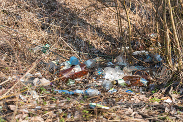 Illegal garbage dump in nature. Dirty garbage polluting the environment