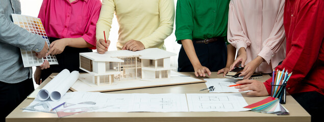 Cropped image of professional architect team brainstorm about house color selection while architect...