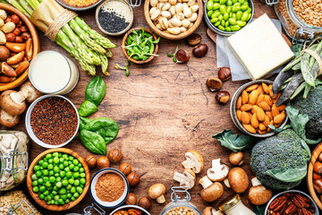 Vegan food background with empty space. Plant protein., vegetarian nutrition sources. Healthy eating, diet ingredients: legumes, beans, lentils, nuts, soy milk, tofu, cereals, seeds and sprouts