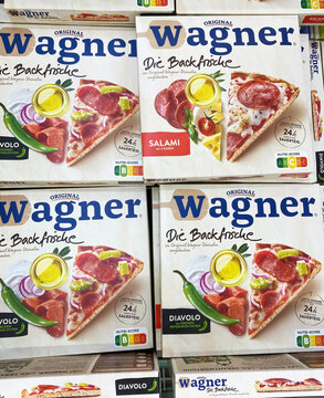 Viersen, Germany - May 9. 2024: Closeup of frozen Die Backfrische Wagner Pizza boxes in store freezer
