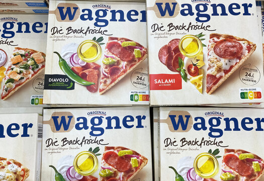Viersen, Germany - May 9. 2024: Closeup of frozen Die Backfrische Wagner Pizza boxes in store freezer