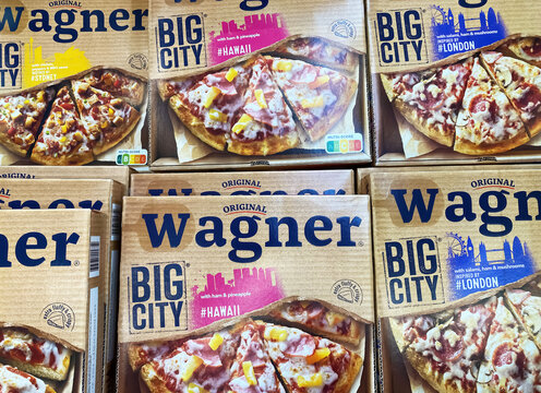 Viersen, Germany - May 9. 2024: Closeup of frozen Wagner Big City  Pizza boxes in store freezer