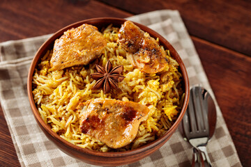 Indian Traditional Chicken Biryani Rice in Clay Bowl on Linen Napkin