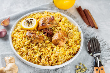 Authentic Chicken Biryani with Spiced and Lemon on White Plate, Traditional Non-Vegetarian Food of India