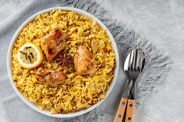 Authentic Chicken Biryani with Spiced and Lemon on White Plate, Traditional Non-Vegetarian Food of India