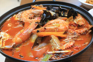 close up of stir-fried spicy seafood soup
