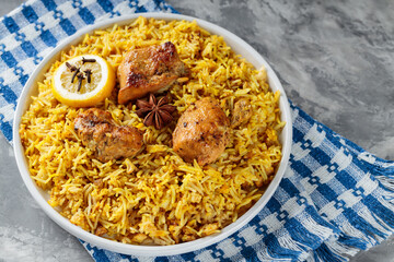 Indian Dish Chicken Biryani with Basmati Rice on White Plate, Close-up