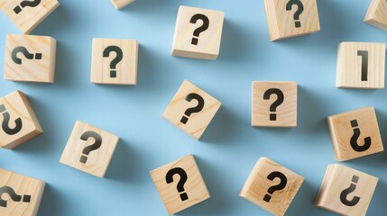 Obraz premium Blocks with question marks on a blue background