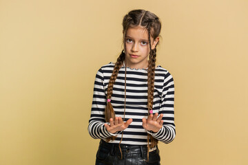 Hey you, be careful. Strict preteen child girl kid warning with admonishing hands gesture saying no...