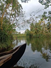Obraz premium A canoe is a lightweight narrow water vessel, typically pointed at both ends and open on top, propelled by one or more seated or kneeling paddlers facing the direction of travel and using paddles. 
