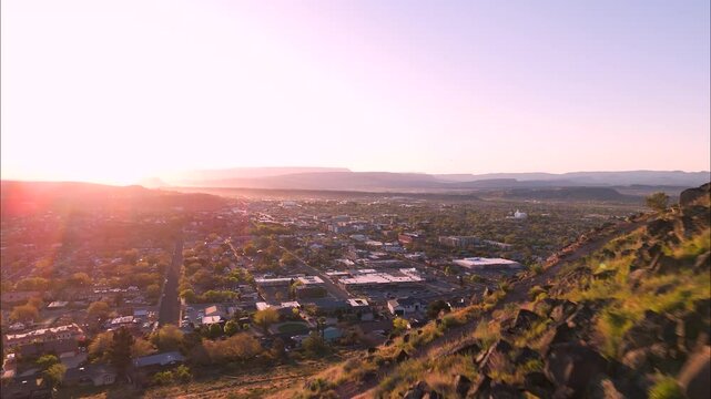 Aerial view of a sunrise over the hills in St George Utah.