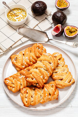 passion fruit puff pastry turnovers on a plate