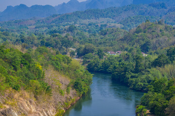 An aerial view of the dam-caused canal in Thailand's national park, with a mountain the background.  Bird eye view.