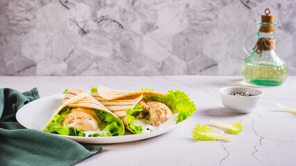 Dietary grilled tacos with chicken fillet, lettuce on a plate on the table web banner