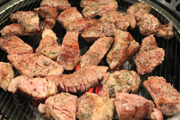 delicious grilled meat on barbecue