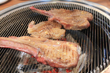delicious grilled meat on barbecue