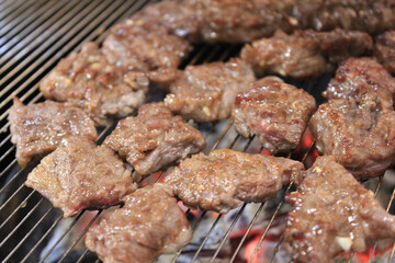 delicious grilled meat on barbecue