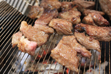 delicious grilled meat on barbecue