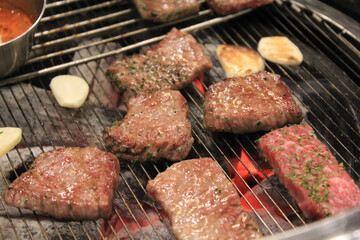 delicious grilled meat on barbecue