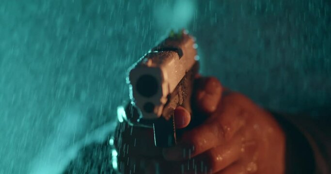 Mysterious Man Shoots Handgun Towards Camera At Night in the Rain, Crime, Murder, Deadly, Close