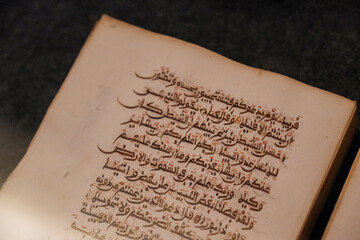 Timeless Script: Ancient Arabic Writing on Quran Page