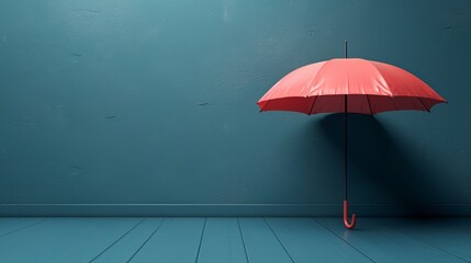   A red umbrella atop a wooden floor Nearby, a blue wall casts a shadow of a person, holding a red umbrella