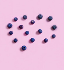 blueberries on a pink background