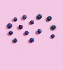 blueberries on a pink background