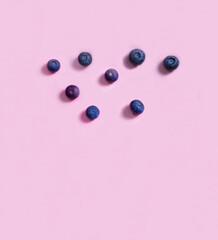 blueberries on a pink background