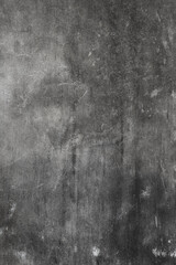 Front view of dirty and weathered wall with scratches on the surface. Abstract full frame textured grunge background in black and white, copy space.