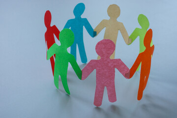 Circle of colored paper people. Concept of unity, diversity and teamwork.