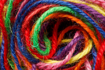 Close-up of different colored threads.