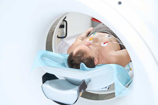 Patient is undergoing contrast-enhanced ECG-gated coronary CT angiography