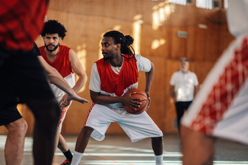 Middle eastern muslim male basketball player practicing with his team