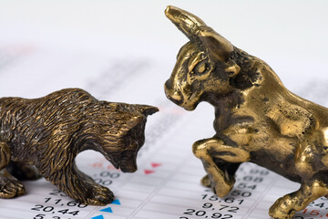 Bronze bull and bear on a financial data - 791102190